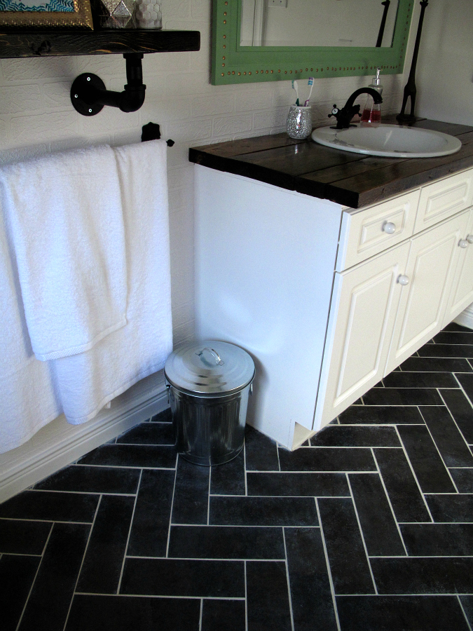 DIY Herringbone Floor Using Peel n' Stick Luxury Vinyl Tile! http://sharktails.ca/2016/01/10/herringbone-floor/