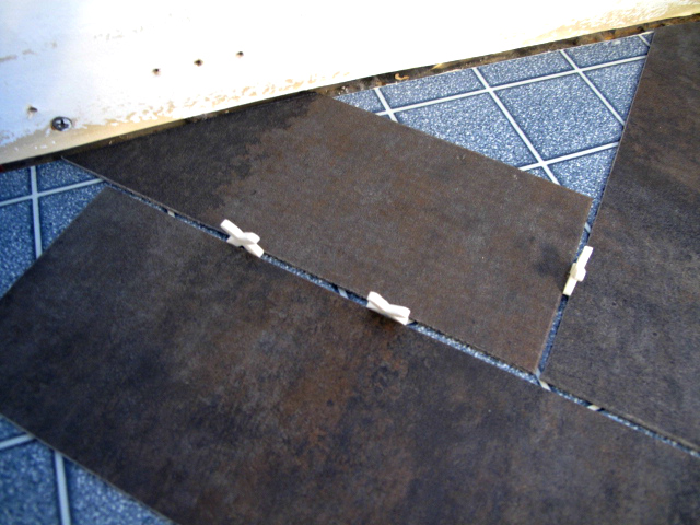 DIY Herringbone Floor Using Peel n' Stick Luxury Vinyl Tile! http://sharktails.ca/2016/01/10/herringbone-floor/